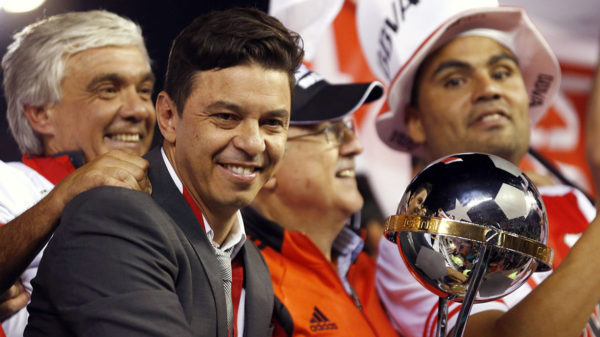 Marcelo Gallardo (3rd R), coach of Argentina's River Plate, celebrates with the trophy after his team won their Copa Sudamericana finals soccer match against Atletico Nacional of Colombia, in Buenos Aires December 10, 2014. REUTERS/Marcos Brindicci (ARGENTINA - Tags: SPORT SOCCER)